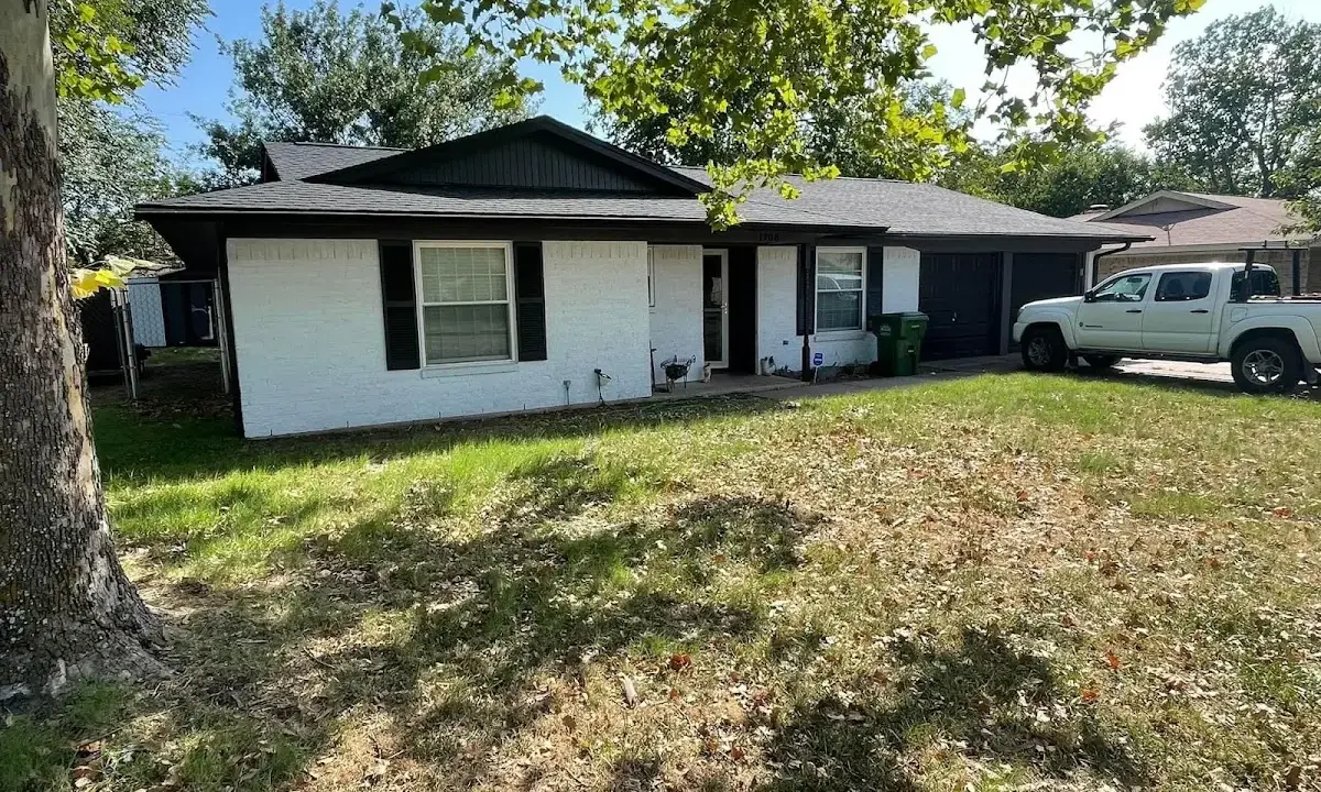 Professional roofing crew working on a residential roof in Maumelle